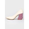 Leather beige shoes with a colored geometric heel in strip