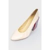 Leather beige shoes with a colored geometric heel in strip