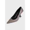 Brown leather shoes with a figured heel