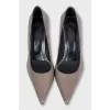 Brown leather shoes with a figured heel