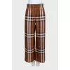 Brown silk pants with signature print