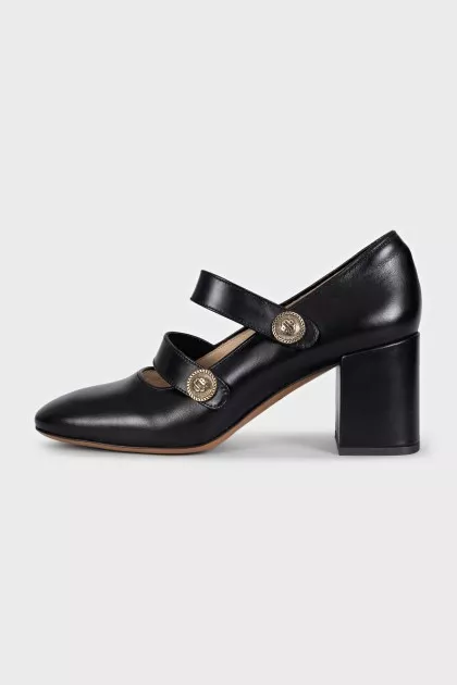 Black leather shoes with gold decor