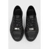Black leather sneakers on lacing