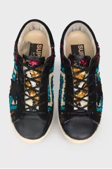 Leather sneakers with rhinestones on lacing