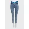 Blue jeans with a signature print