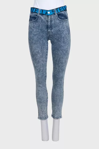 Blue jeans with a signature print