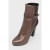 Leather brown boots with a strap