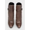 Leather brown boots with a strap