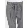 Gray trousers with patch pockets