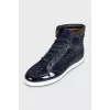 High-top leather sneakers decorated with crystals