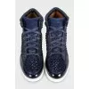 High-top leather sneakers decorated with crystals