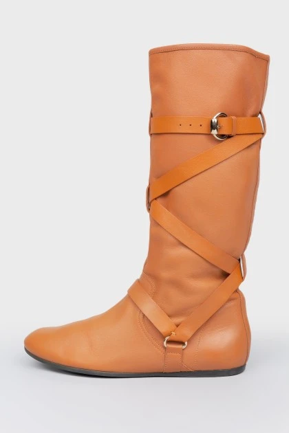 Brown leather boots with metal buckle