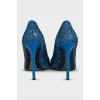 Leather shoes decorated with lace