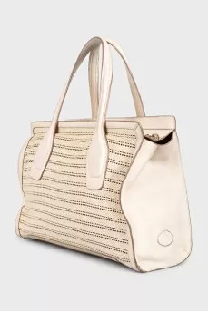 Bag made of textile and leather with perforation
