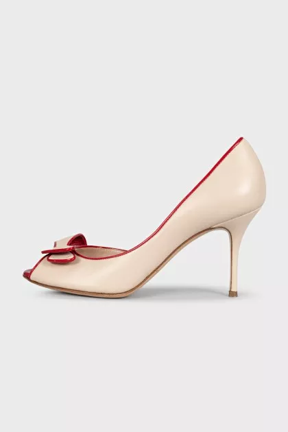 Beige leather shoes with red trim