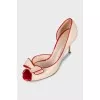 Beige leather shoes with red trim