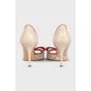 Beige leather shoes with red trim