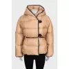 Beige down jacket with leather trim
