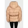 Beige down jacket with leather trim