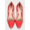 Orange leather stiletto heels