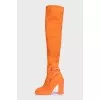 Orange suede over-the-knee boots with heels