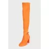Orange suede over-the-knee boots with heels