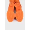 Orange suede over-the-knee boots with heels