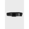 Black leather belt with a massive buckle
