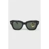 Rectangular black sunglasses with tag