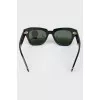 Rectangular black sunglasses with tag