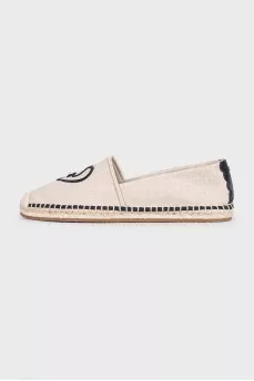 Gray espadrilles decorated with embroidery