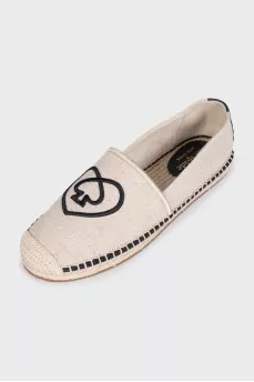 Gray espadrilles decorated with embroidery