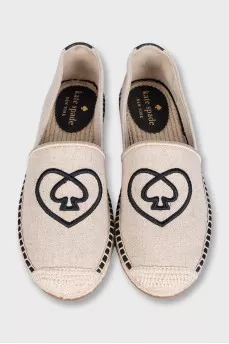 Gray espadrilles decorated with embroidery