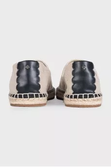 Gray espadrilles decorated with embroidery