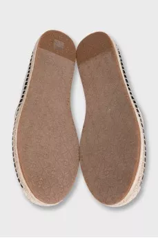 Gray espadrilles decorated with embroidery