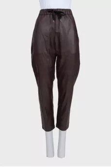 Brown leather trousers with tag