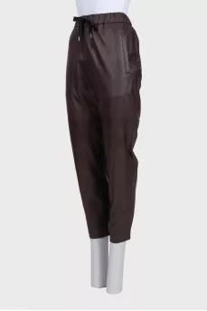 Brown leather trousers with tag