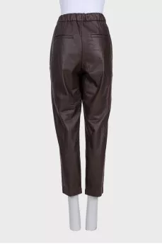 Brown leather trousers with tag