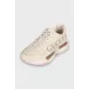 Beige leather sneakers with logo