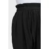 Tapered black trousers with elastic waistband