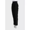 Tapered black trousers with elastic waistband