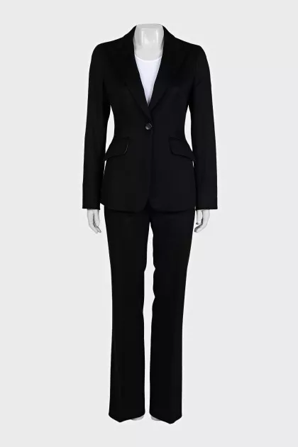 A suit consisting of a fitted jacket and straight trousers