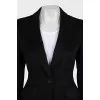 A suit consisting of a fitted jacket and straight trousers
