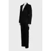A suit consisting of a fitted jacket and straight trousers