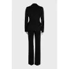 A suit consisting of a fitted jacket and straight trousers
