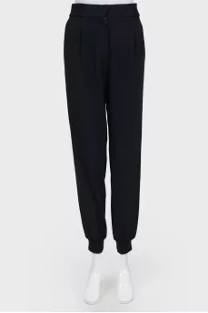 Black trousers with red and black stripes