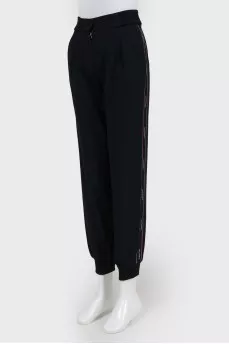 Black trousers with red and black stripes