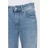 Light blue jeans with a distressed effect