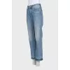 Light blue jeans with a distressed effect