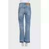 Light blue jeans with a distressed effect